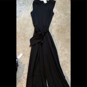 High neck black romper with wide leg and tie